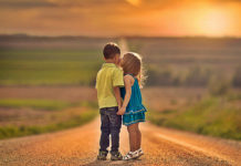 Little Boy And Little Girl Kiss